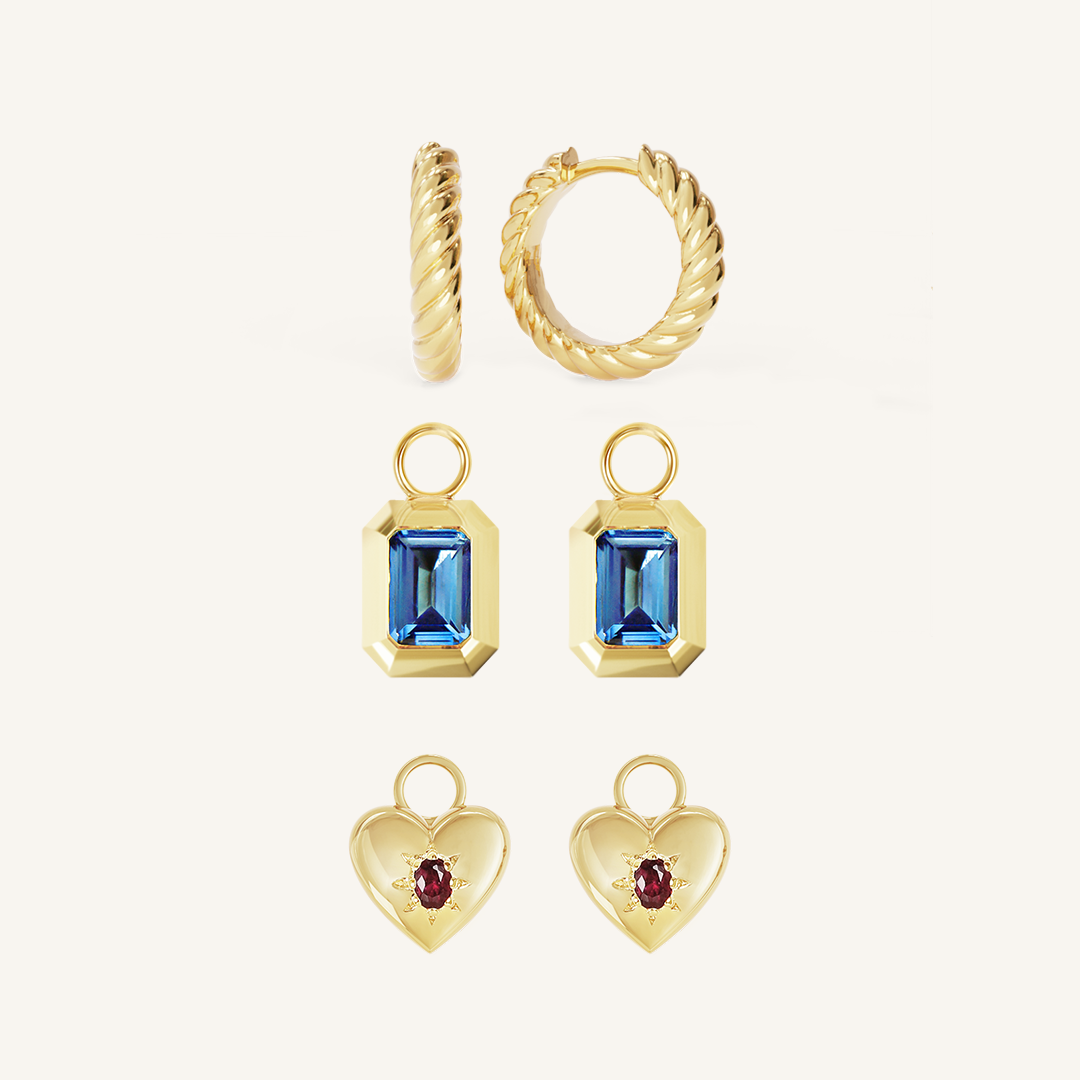 gold delicate hoops with a twist design rectangular hoop charms with deep blue cubic zirconia heart shaped hoop charms with deep red cubic zirconia 