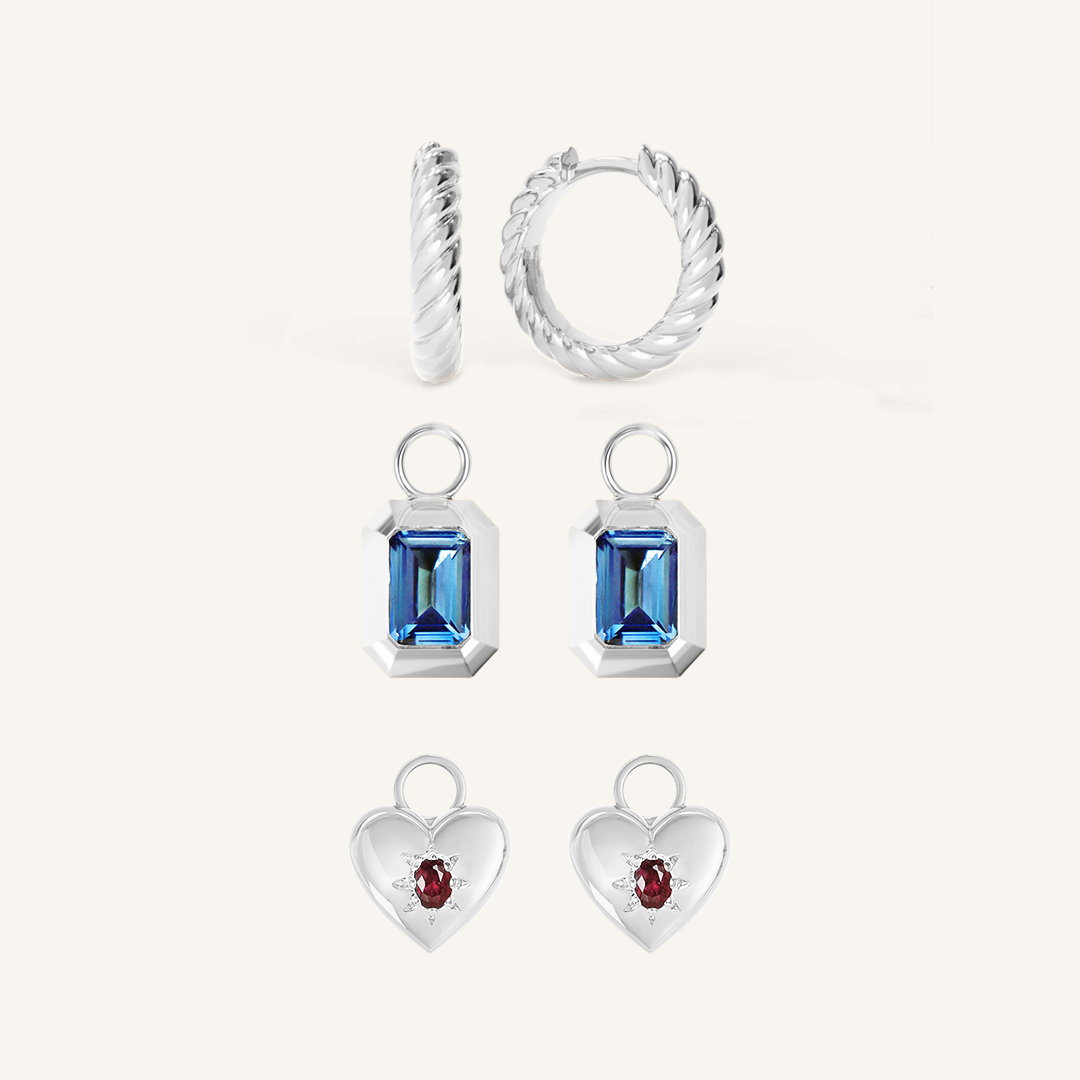 silver delicate hoops with a twist design rectangular hoop charms with deep blue cubic zirconia heart shaped hoop charms with deep red cubic zirconia 