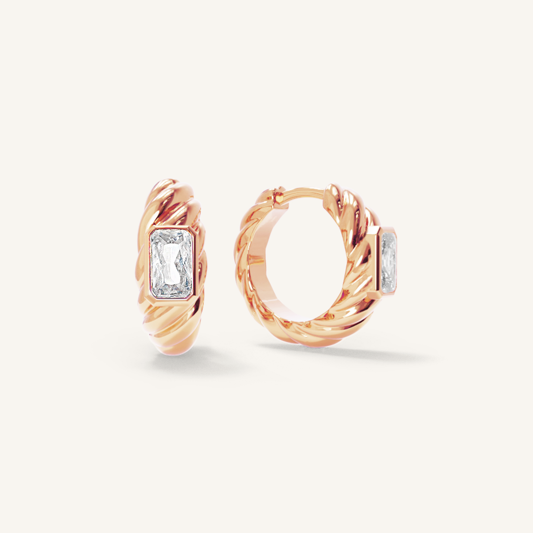 rose gold hoops inspired by the Louvre's architecture with Marquise cut white cubic zirconias bezel set on white background