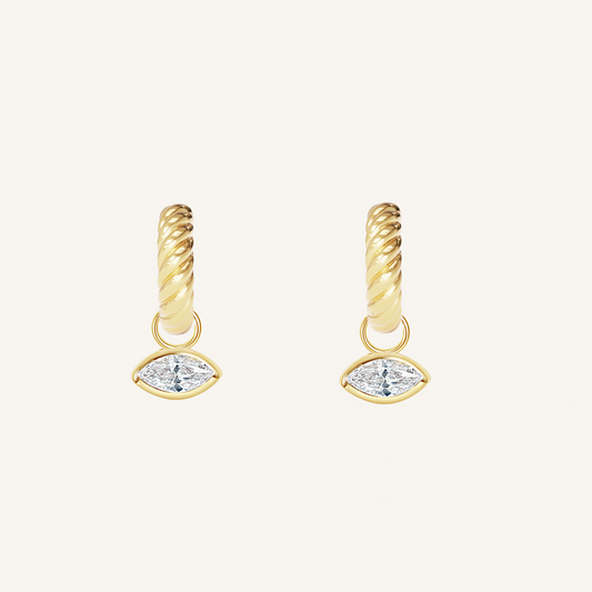 gold hoops inspired by the Louvre's architecture with Marquise cut white cubic zirconias bezel set hoop charms on white background