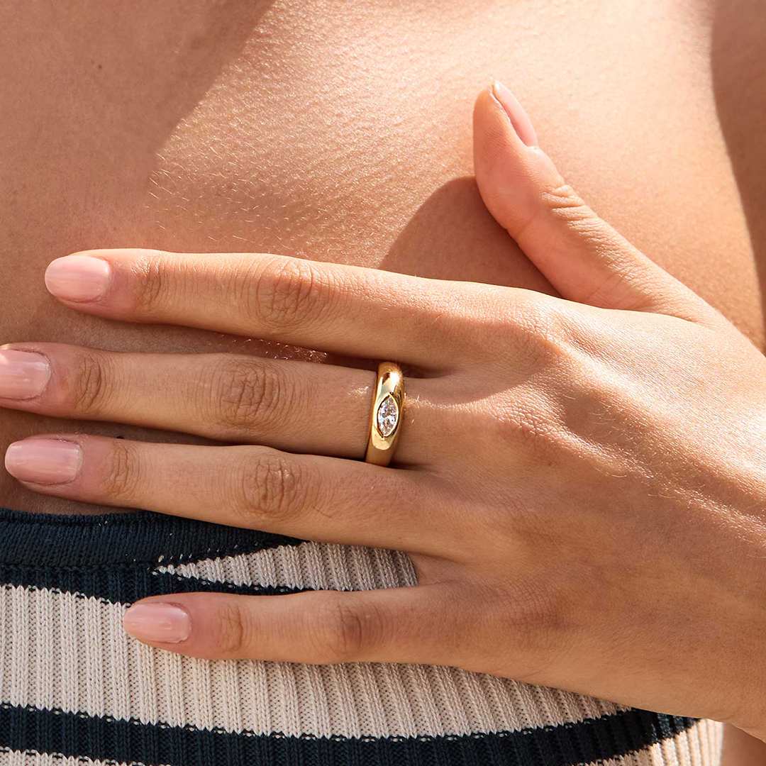 gold ring inspired by the Louvre's architecture with Marquise cut white cubic zirconia bezel set on the finger