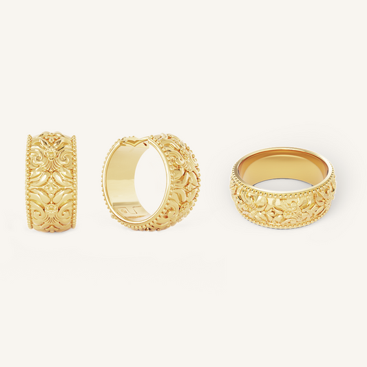 intricately designed statement gold hoops with matching ring on white background