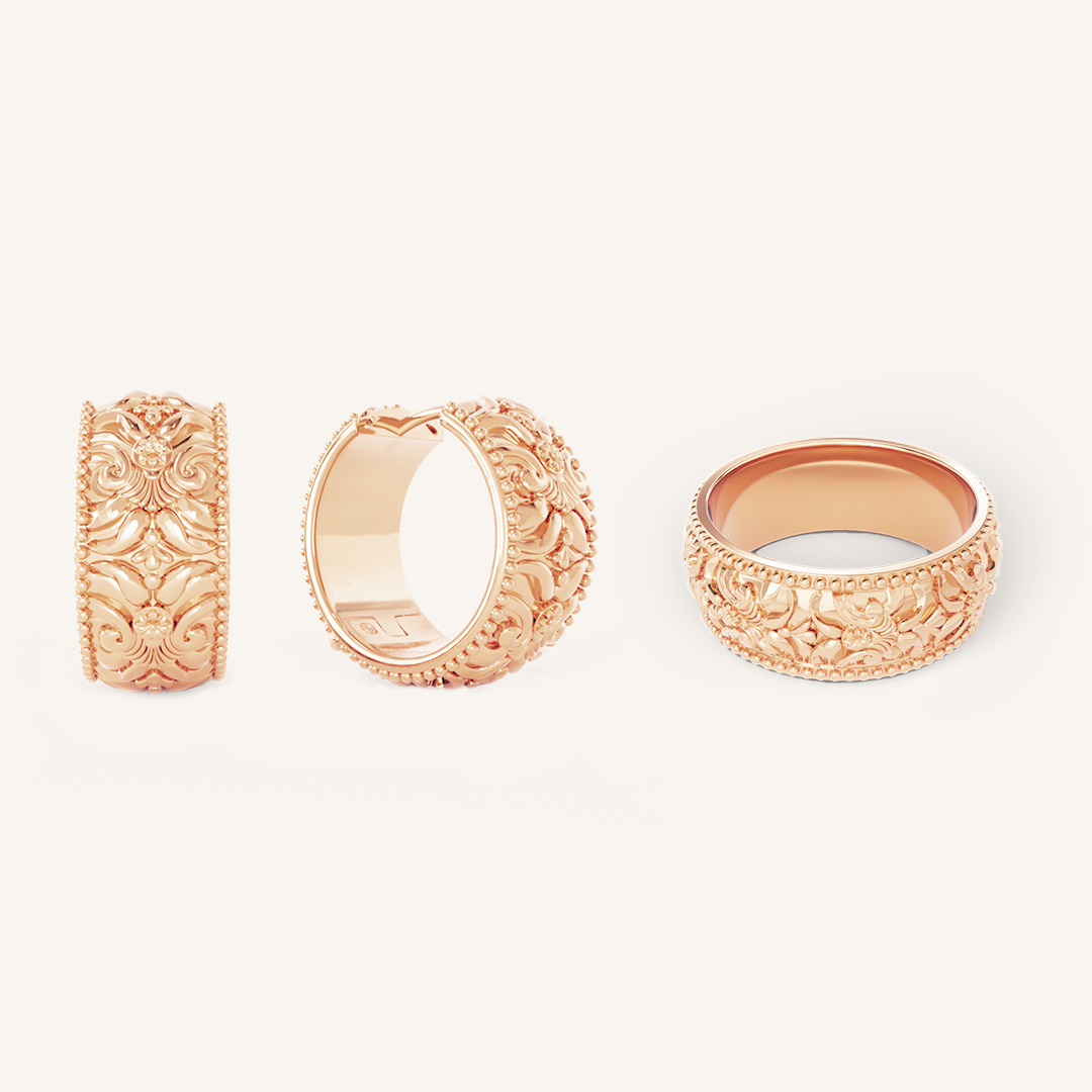 intricately designed statement rose gold hoops with matching ring on white background