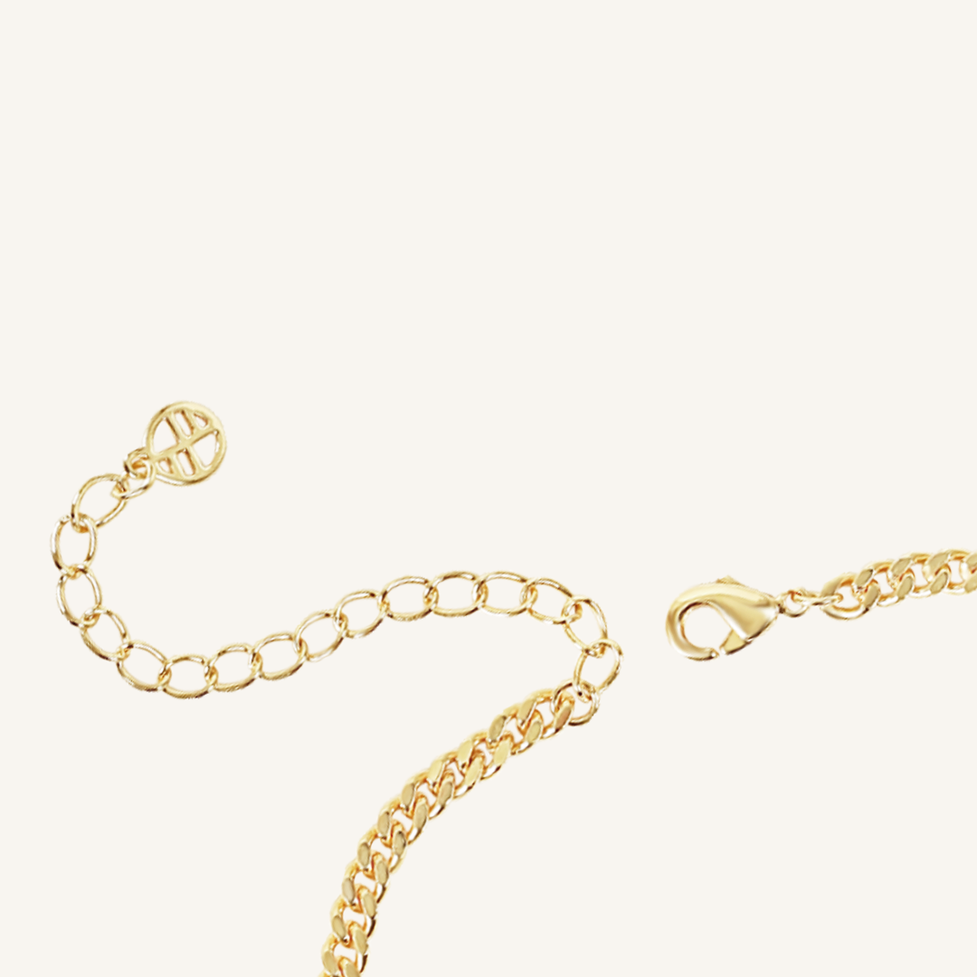 Gold chain bracelet extender with Francesca Logo on white background close up