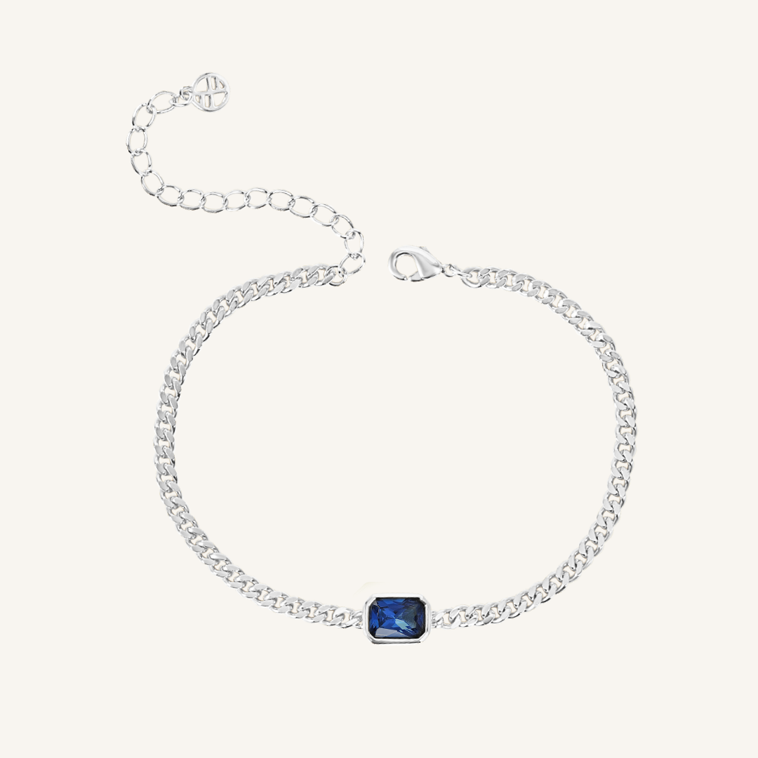 silver chain bracelet with Navy blue cubic zirconia bezel set in centre Inspired by the halls of Versailles on white background