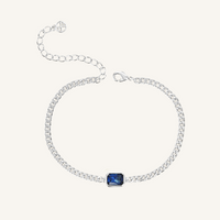 silver chain bracelet with Navy blue cubic zirconia bezel set in centre Inspired by the halls of Versailles on white background