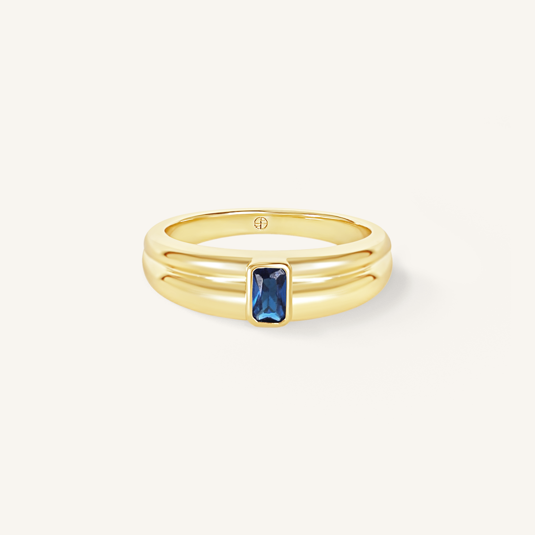 Gold ring with Navy blue cubic zirconia bezel set Inspired by the halls of Versailles on white background 