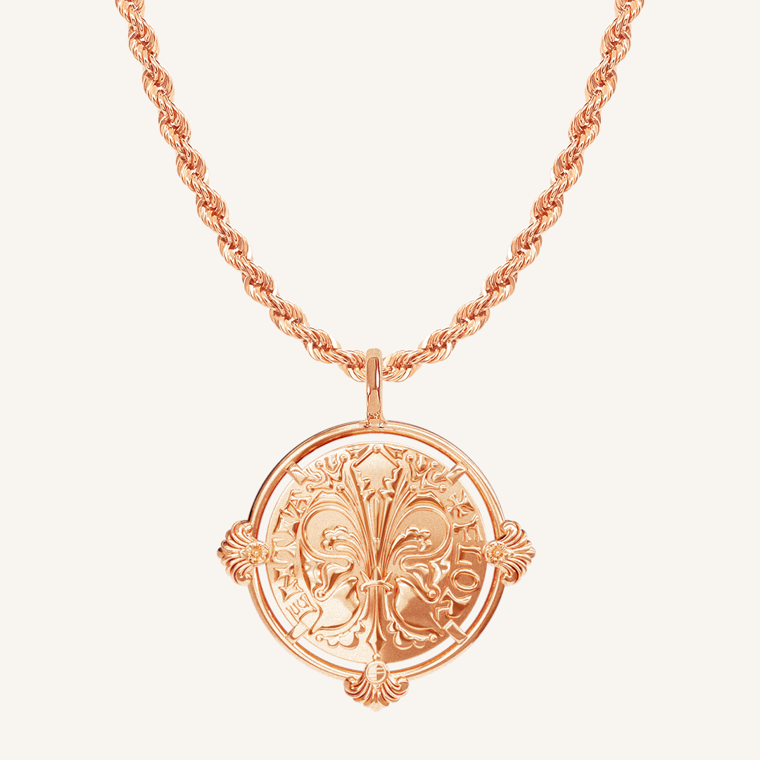 rose gold pendant featuring intricate patterns inspired by Palace of Versailles on rose gold rope chain a plain background