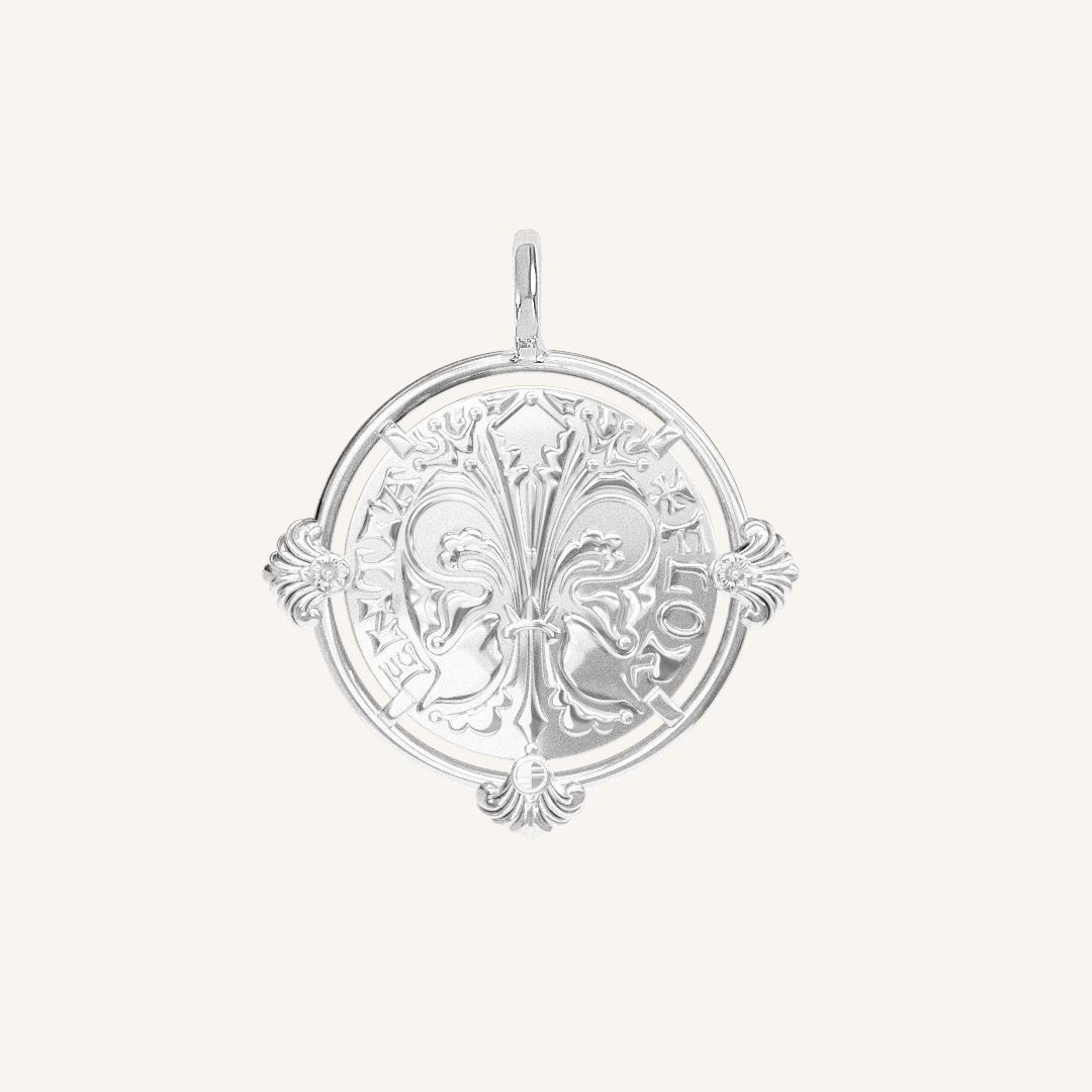 silver pendant featuring intricate patterns inspired by Palace of Versailles on a plain background
